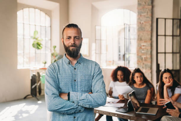 istock Portrait of a man standing in his office 1425491812