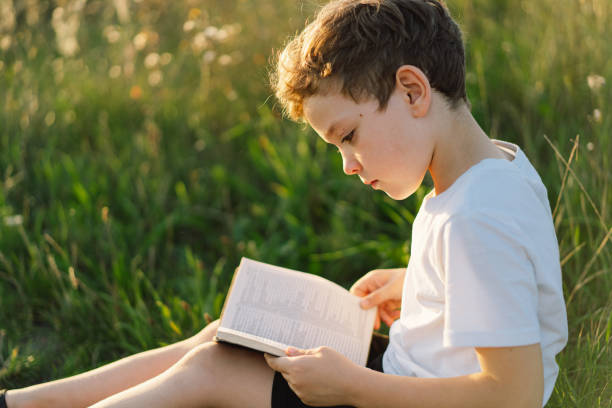 istock Christian boy holds bible in her hands 1425501375