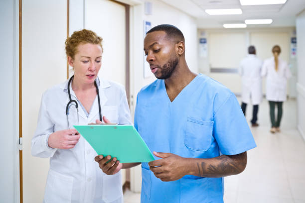 istock Doctor and nurse discussing over clipboard 1425504006