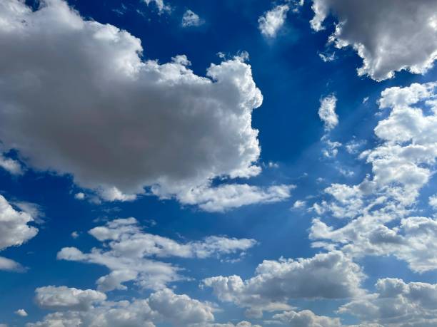 istock Full frame shot of blue sky and clouds with sunshine 1425508121