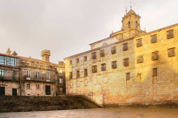 Santiago de Compostela, Spain - December 14, 2013 - View of the beautiful facade of the Hostal Dos Reis Catolicos hotel, build in 1486 that is considered the first hotel in the world. (text translation: Hostal de los reyes catolicos: Reyes Catolicos hostel)