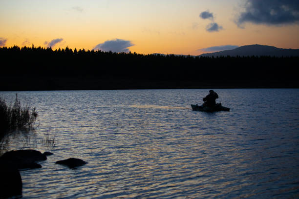 istock SILHOUETTE OF A FLY FISHERMAN 1425513776