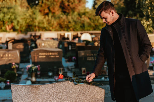 istock Man in the cemetery 1425515479