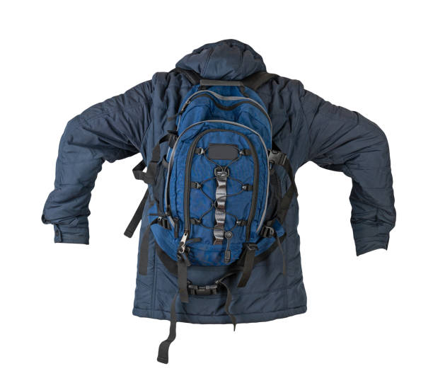istock black backpack dressed in a red jacket isolated on a white background. 1425516360
