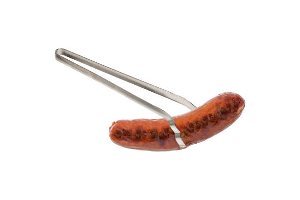 Tongs Holding a Grilled Bratwurst Isolated on White