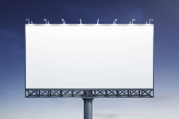 istock Blank white horizontal billboard on blue sky background at evening, front view. Mock up, advertising concept 1425522041