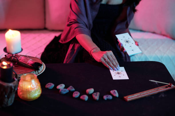 istock Woman Laying out Tarot Cards 1425524578