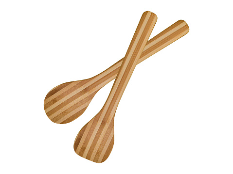 Wooden cooking utensils on white background