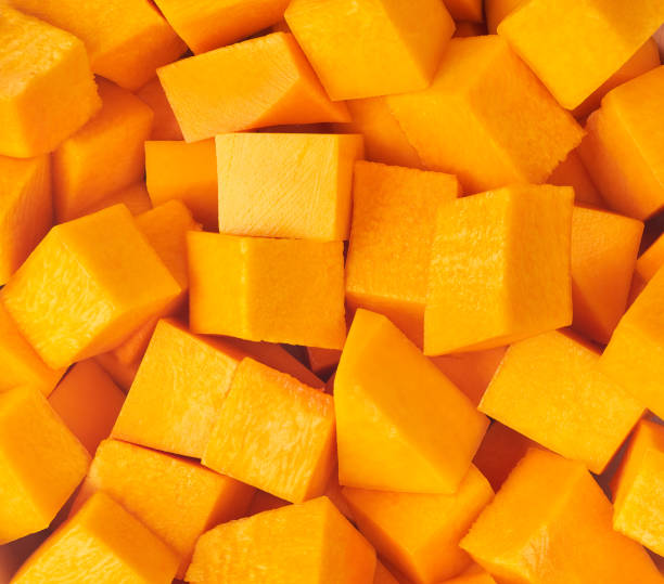 textured diced butternut squash close up. stock photo