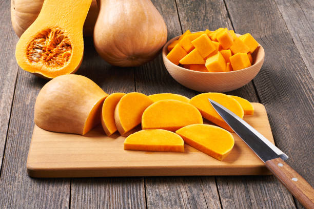 istock Butternut squash, cut into slices and ready for cooking. 1425530605