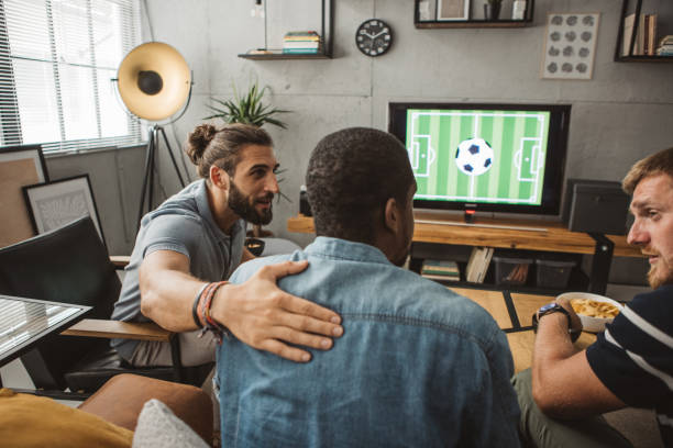 istock Watching soccer championship at home 1425531279