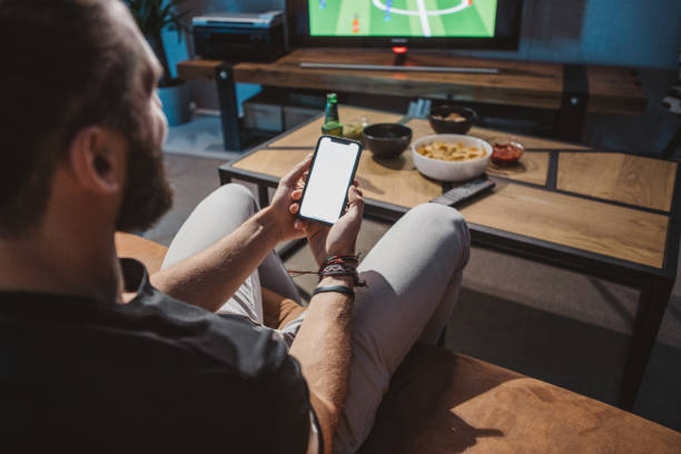 istock Watching soccer game at home 1425531428