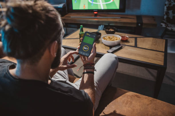 istock Watching soccer game at home 1425531487