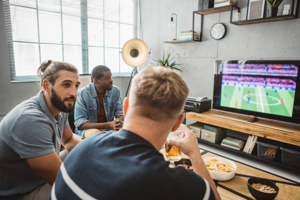 istock Watching soccer championship at home 1425531602
