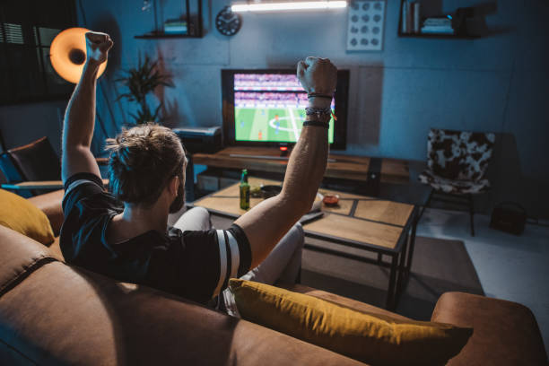 istock Watching soccer game at home 1425531695