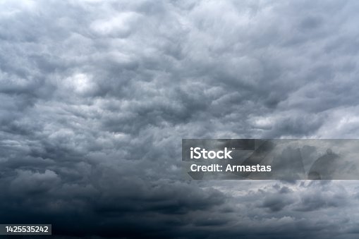 istock Dark cumulus thunderstorm clouds background 1425535242