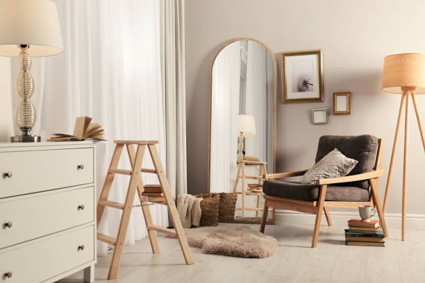istock Stylish room interior with large mirror and comfortable armchair 1425540366