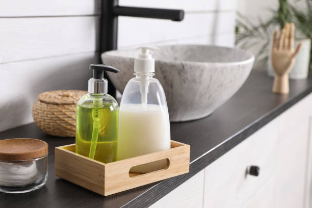 istock Dispensers with liquid soap on countertop in bathroom 1425540813