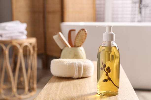 istock Dispenser with liquid soap on wooden table in bathroom, space for text 1425541188
