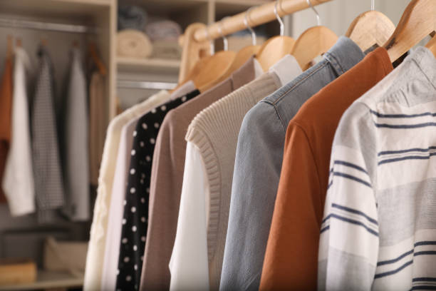istock Wardrobe closet with different stylish clothes indoors, closeup 1425543236