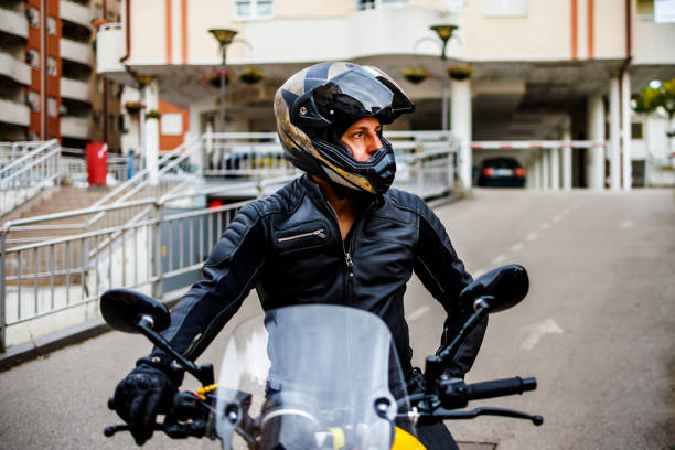 istock Man on motorcycle joins the traffic 1425544261