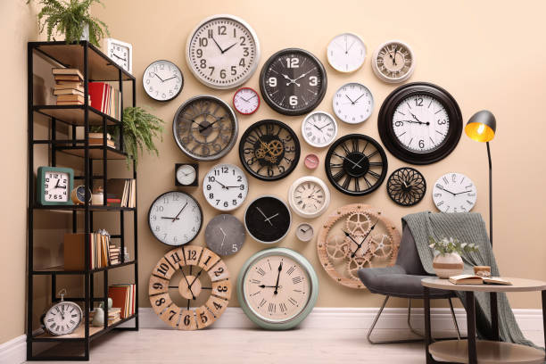 istock Stylish room interior with collection of wall clocks 1425544372