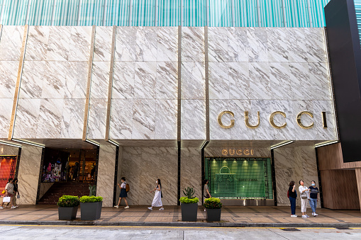 Hong Kong - September 17 , 2022 : Pedestrians walk past Gucci store in Tsim Sha Tsui, Kowloon, Hong Kong.