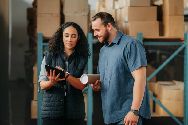 istock Shipping, cargo colleagues and tablet at warehouse with ecommerce stock logistics manager and worker. Online shopping stock with management planning an e commerce and tech supply chain strategy 1425547314