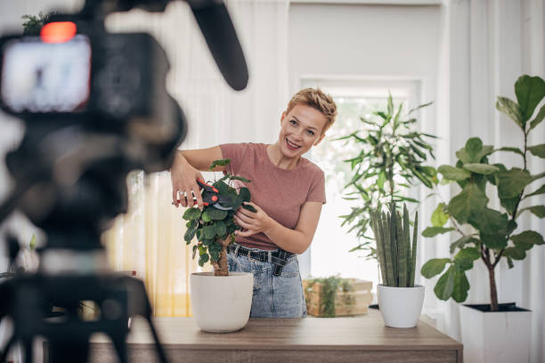istock Woman vlogging about nurturing houseplant 1425549790