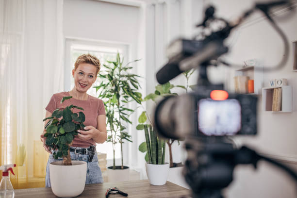 istock Woman vlogging about nurturing houseplant 1425550097