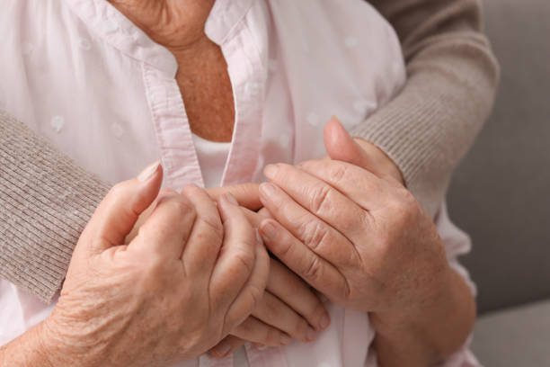 istock Young and elderly women hugging, closeup view 1425550166