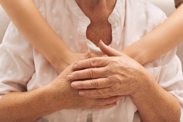 istock Young and elderly women hugging, closeup view 1425550498