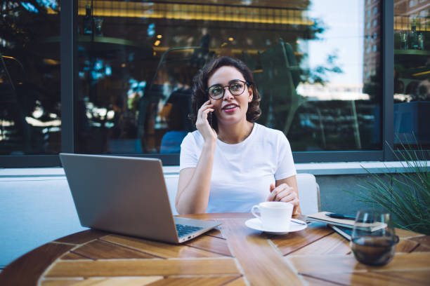 istock Busy freelancer talking on smartphone on terrace 1425552057