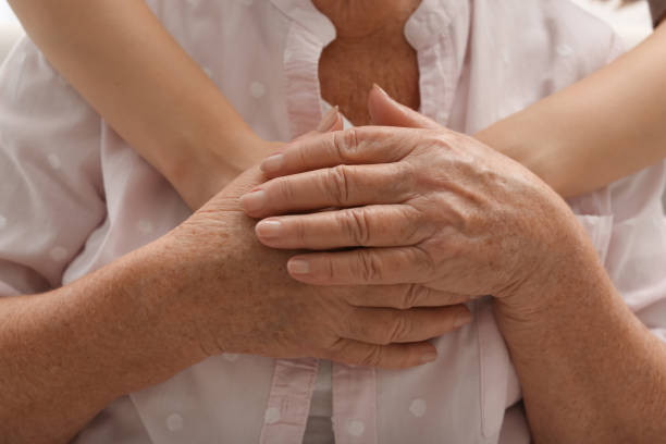 istock Young and elderly women hugging, closeup view 1425552169