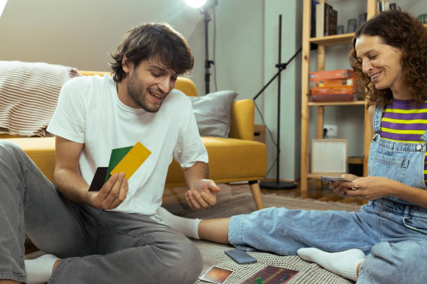 istock Young couple playing a board game and having fun 1425553601