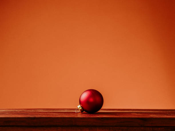 Broken Christmas bauble amongst a Christmas scene