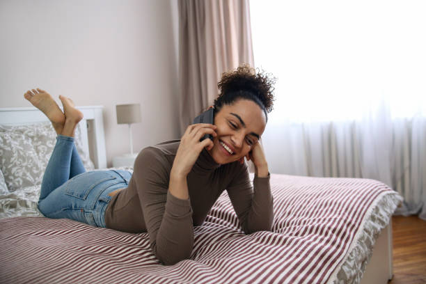 istock Young woman talking on a phone 1425555835