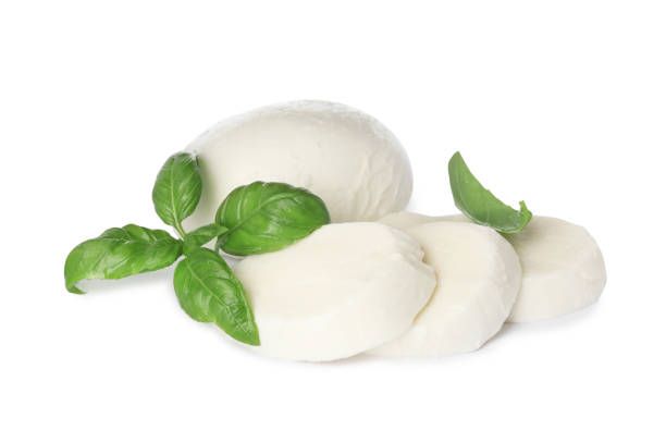 istock Delicious mozzarella cheese slices and basil on white background 1425556419