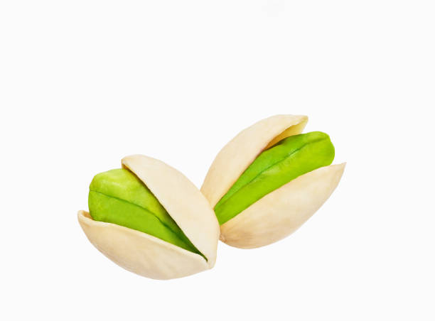 istock two pistachio isolated on white background, clipping path, full depth of field. 1425556994