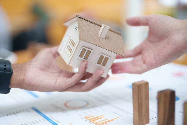 istock Model house and wooden stick, insurance concept 1425557516