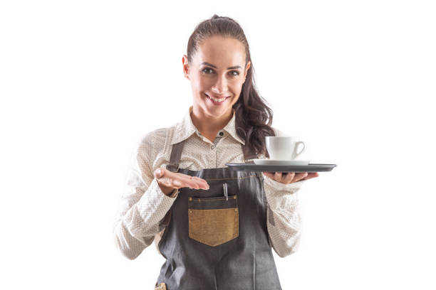 Female Waitress  Serving Food To Romantic Couple Sitting At Restaurant Table