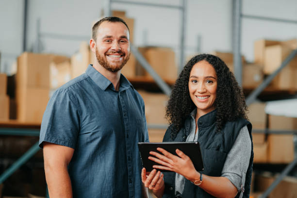 Logistics, ecommerce and people in a warehouse portrait with tablet for stock inventory or package management app. Happy employees, workers or manager working in b2b business or supply chain industry stock photo