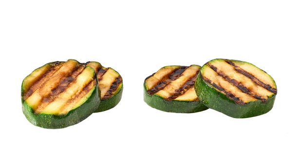 istock Grilled organic zucchini slices isolated on white background. 1425560672