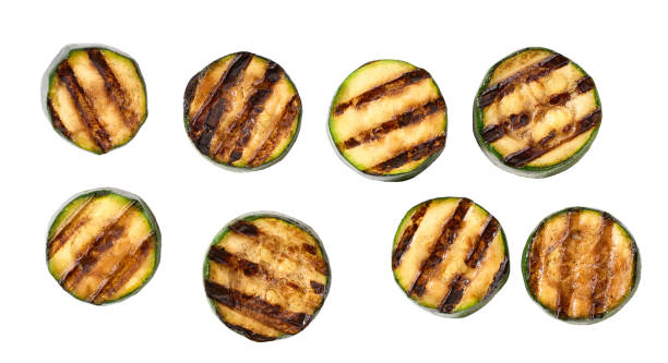 istock Grilled organic zucchini slices isolated on white background, top view. 1425560714