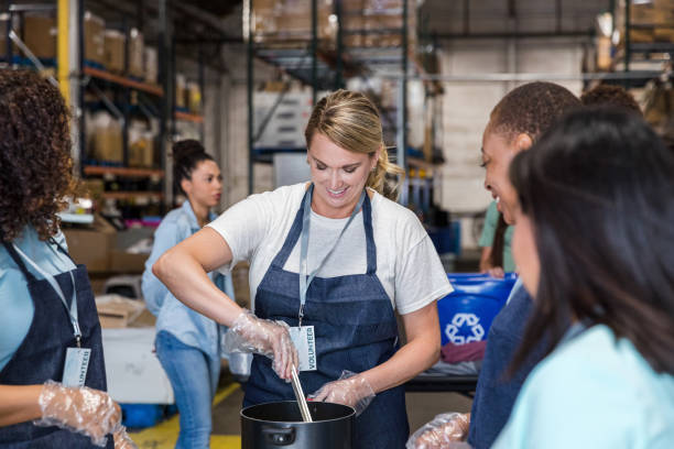 istock Team leader helps show her peers 1425562546