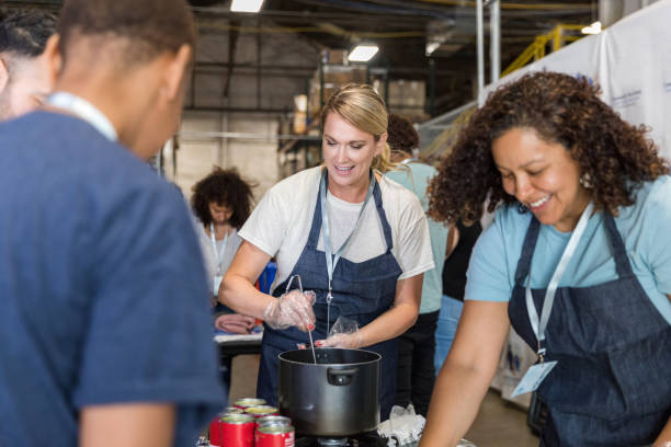 istock Multiracial volunteer group prepares meals for soup kitchen 1425563020