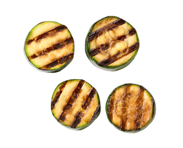istock Grilled organic zucchini slices isolated on white background, top view. 1425564207