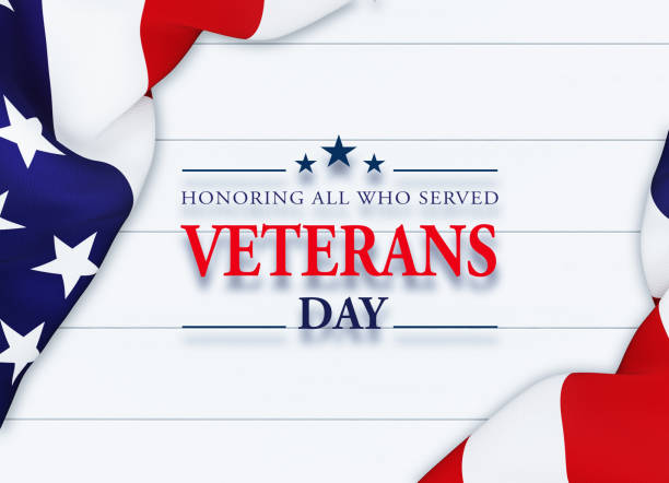Veteran's Day message written over white background behind rippled American flag. Horizontal composition with copy space. Directly above. Veteran's Day concept.