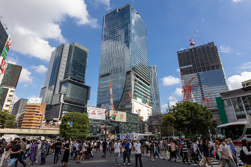Tokyo, Japan - September 3, 2022 : People at Shibuya District, Tokyo, Japan. It is a famous shopping district in Tokyo. Many department stores, boutiques, restaurants, and game centers are located in this district.