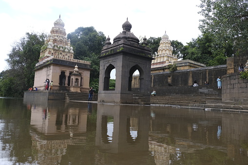 Wai, Maharashtra, India, 18 September 2022, Temple on Krishna Ghat in monsoon season, Bank of Krishna river, Menavali Ghat, Wai, Maharashtra, India.